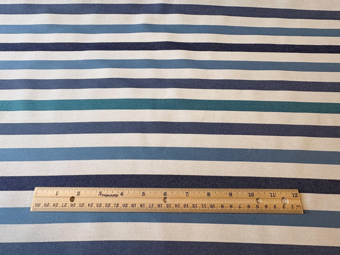 Striped Seasonal Outdoor Fabric Pattern. Varying Shades of Blue Stripes. Teal Stripe, Navy Blue Stripe, and Columbia Blue Stripe Woven Fabric. Shop now at American Fabric Prints.