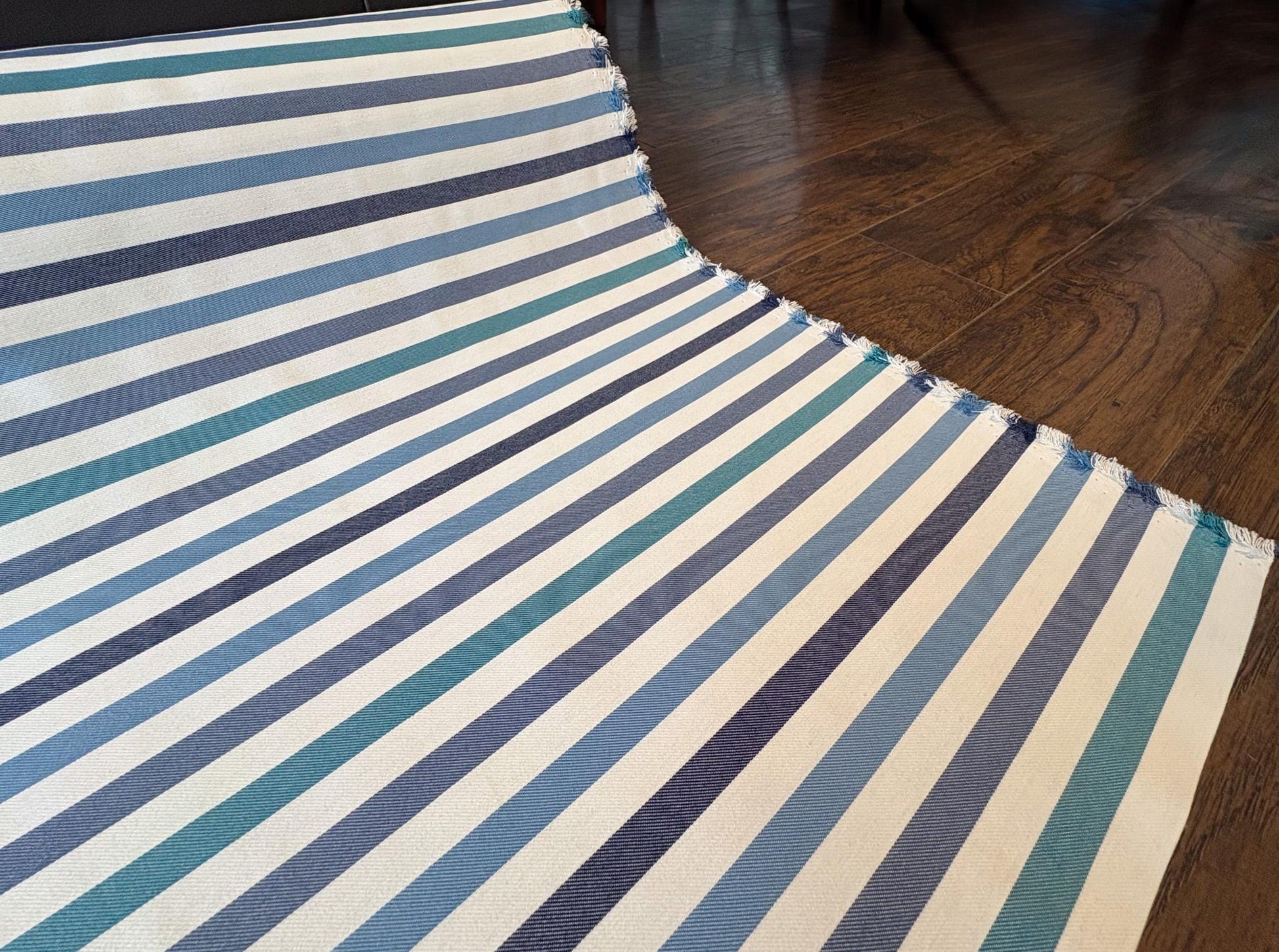 Striped Seasonal Outdoor Fabric Pattern. Varying Shades of Blue Stripes. Teal Stripe, Navy Blue Stripe, and Columbia Blue Stripe Woven Fabric. Shop now at American Fabric Prints.