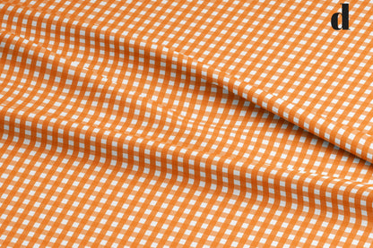 Orange Plaid Fabric. Shop now at American Fabric Prints.