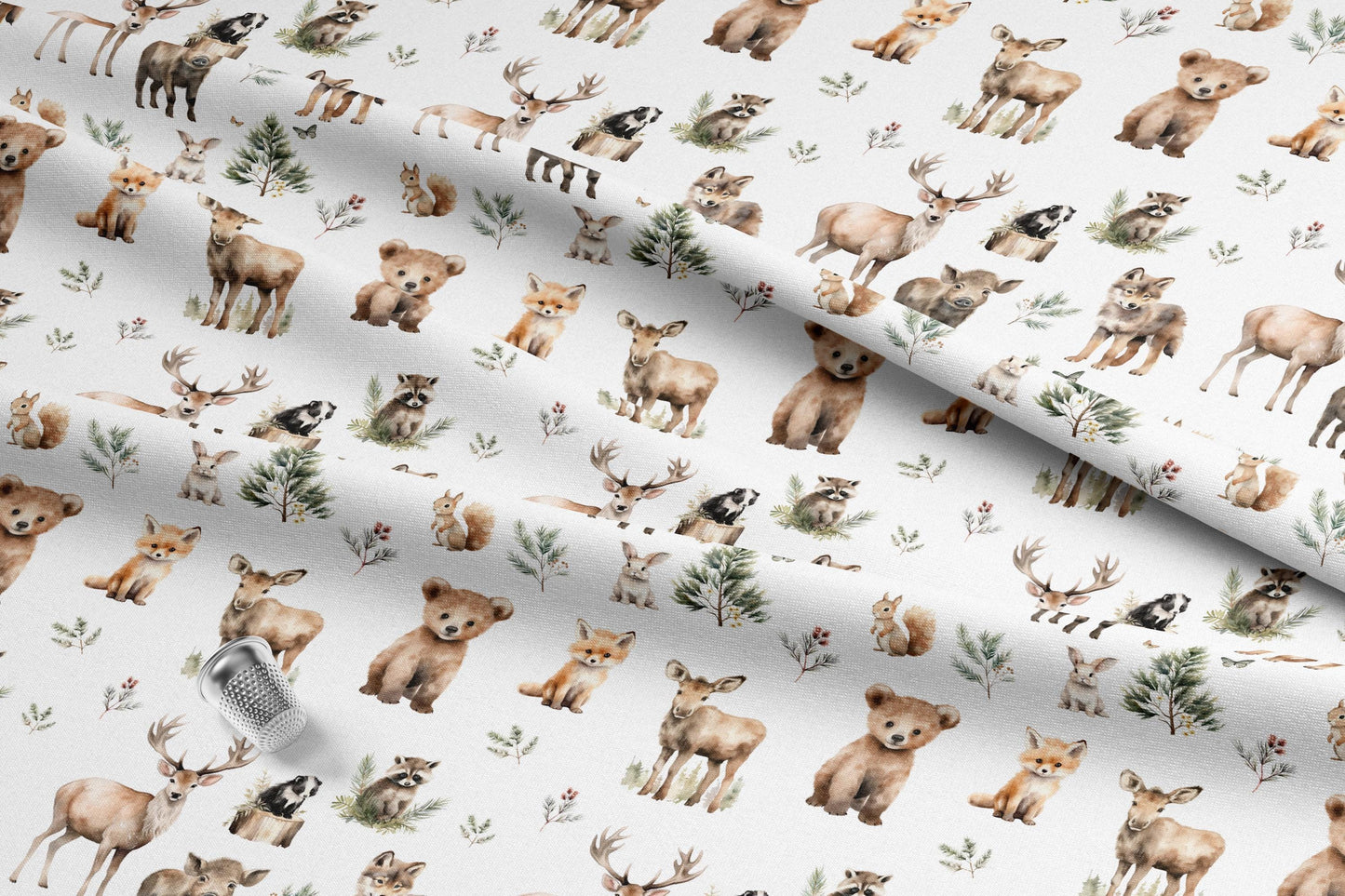 Cute woodland animals fabric with deer, bears, foxes, raccoons, and squirrels. The watercolor-style illustrations are in shades of brown, tan, and green, with small evergreen trees and floral accents. Made in the USA by American Fabric Prints. Shop now.